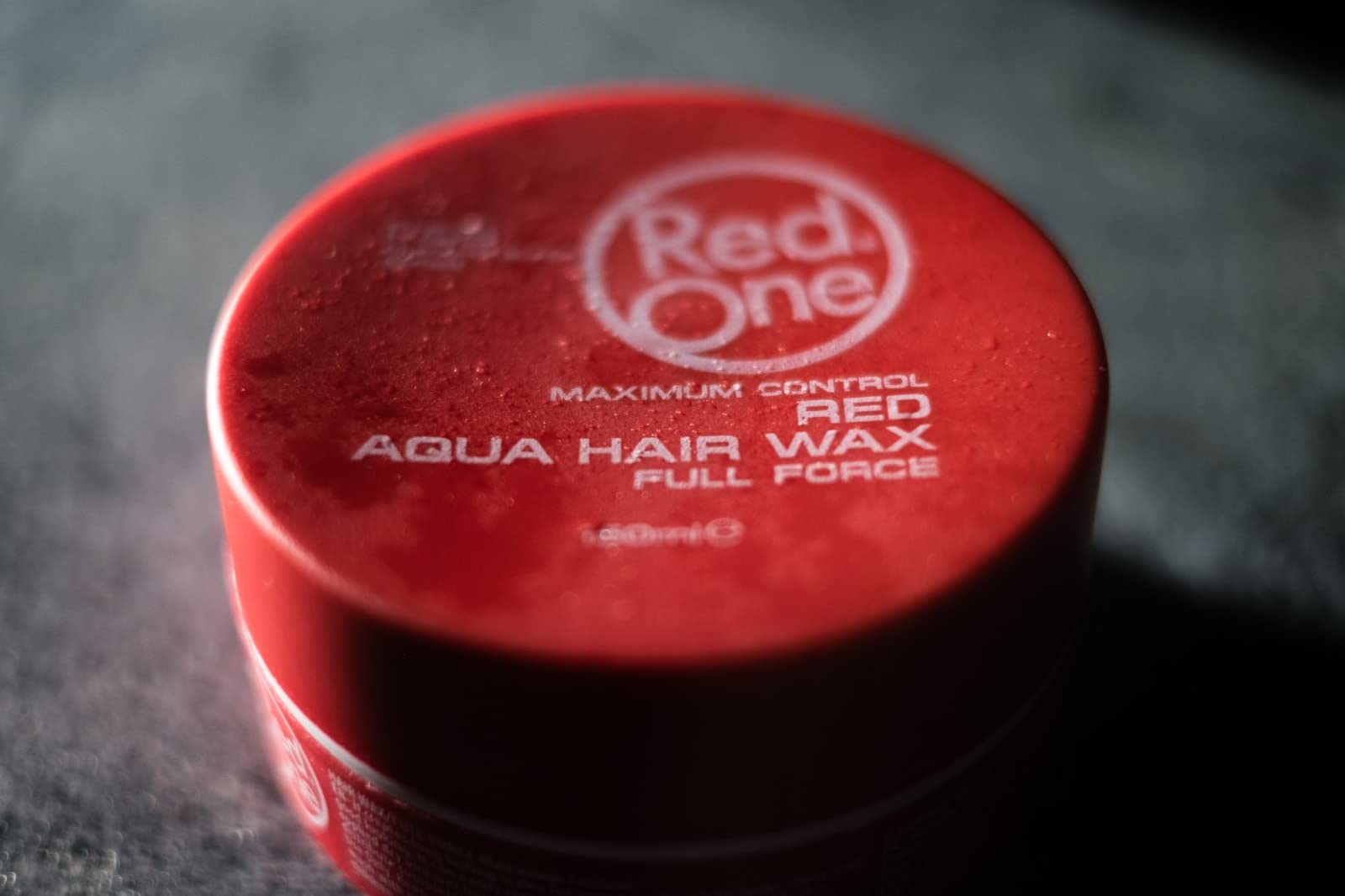 Redone Red One with strawberries representing strawberry scent and fresh appeal