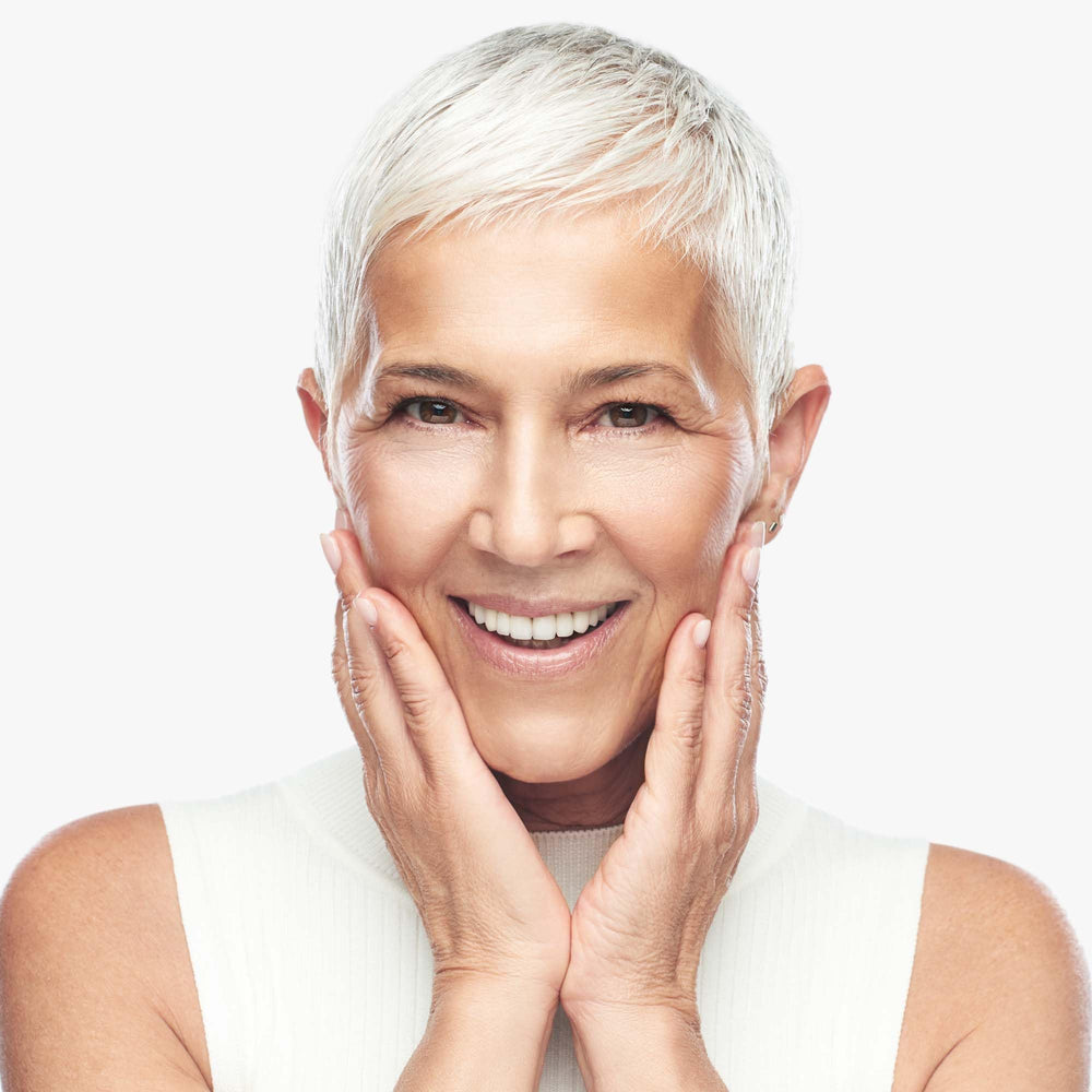 Hand applying Replenix cream to cheek demonstrating moisturization benefits