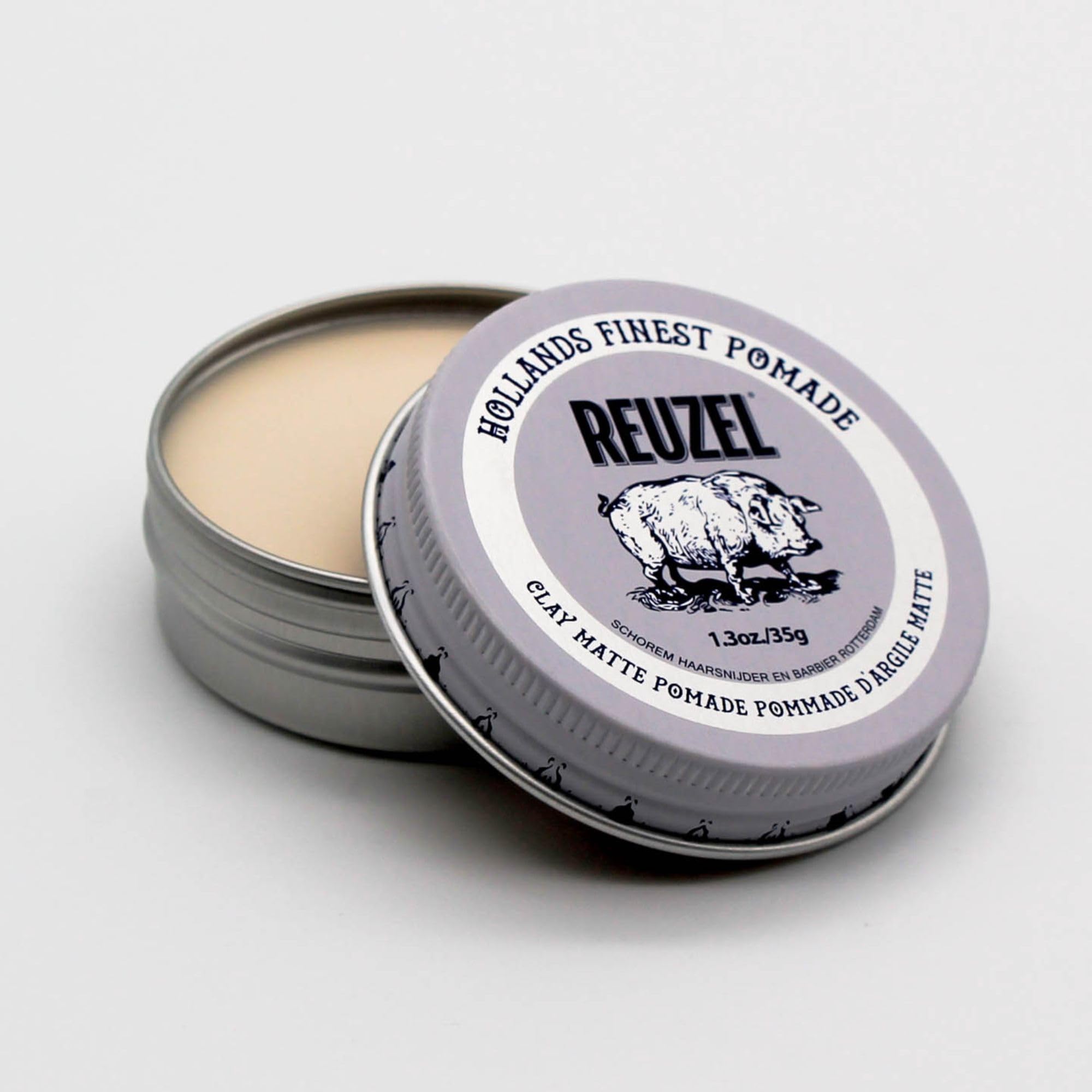 REUZEL pomade on hands showing texture and easy application benefit