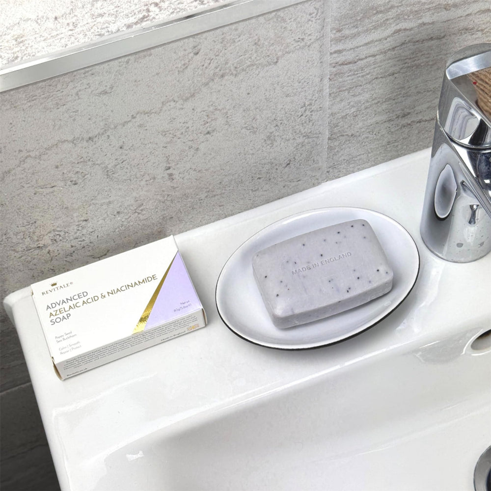 REVITALE soap held in hand to show actual size and travel-friendly scale