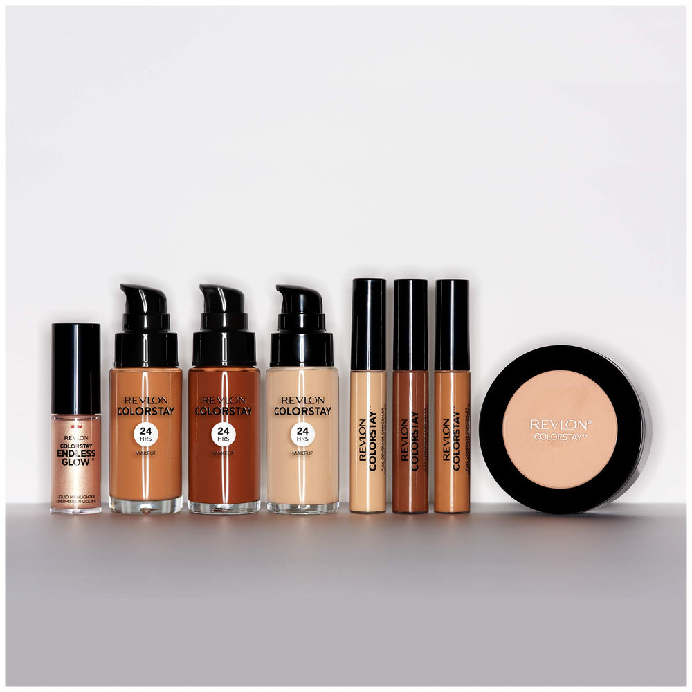 Revlon compact on vanity styled with brushes for polished, longwear makeup