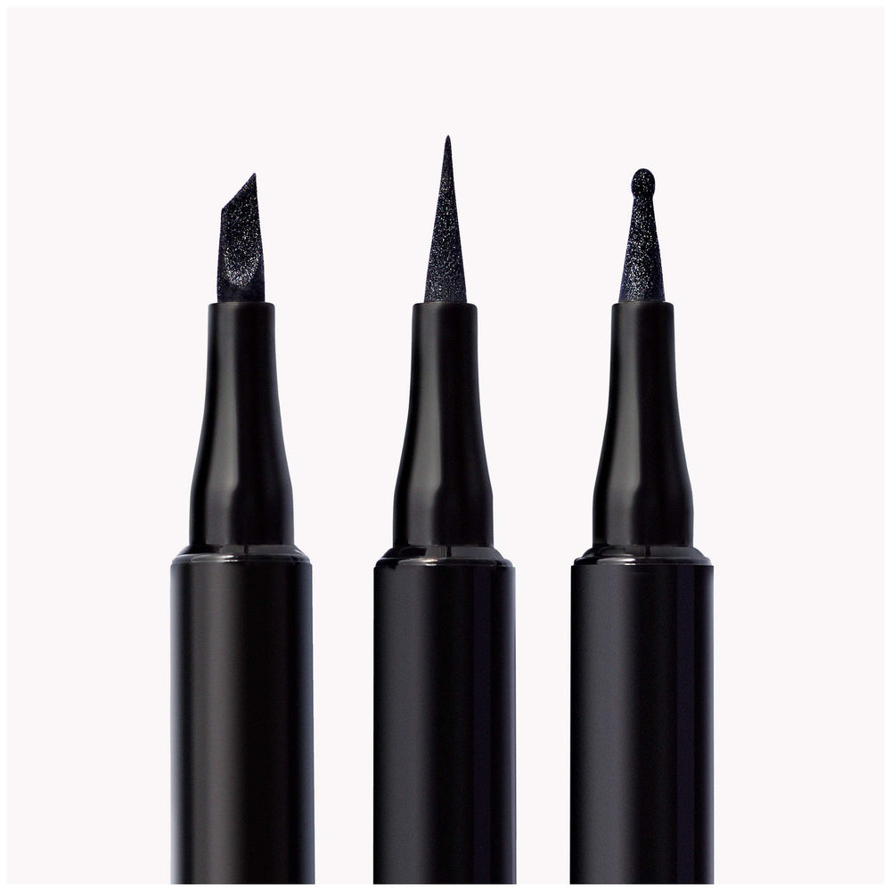 Revlon ColorStay pen next to a hand for size comparison and easy handling