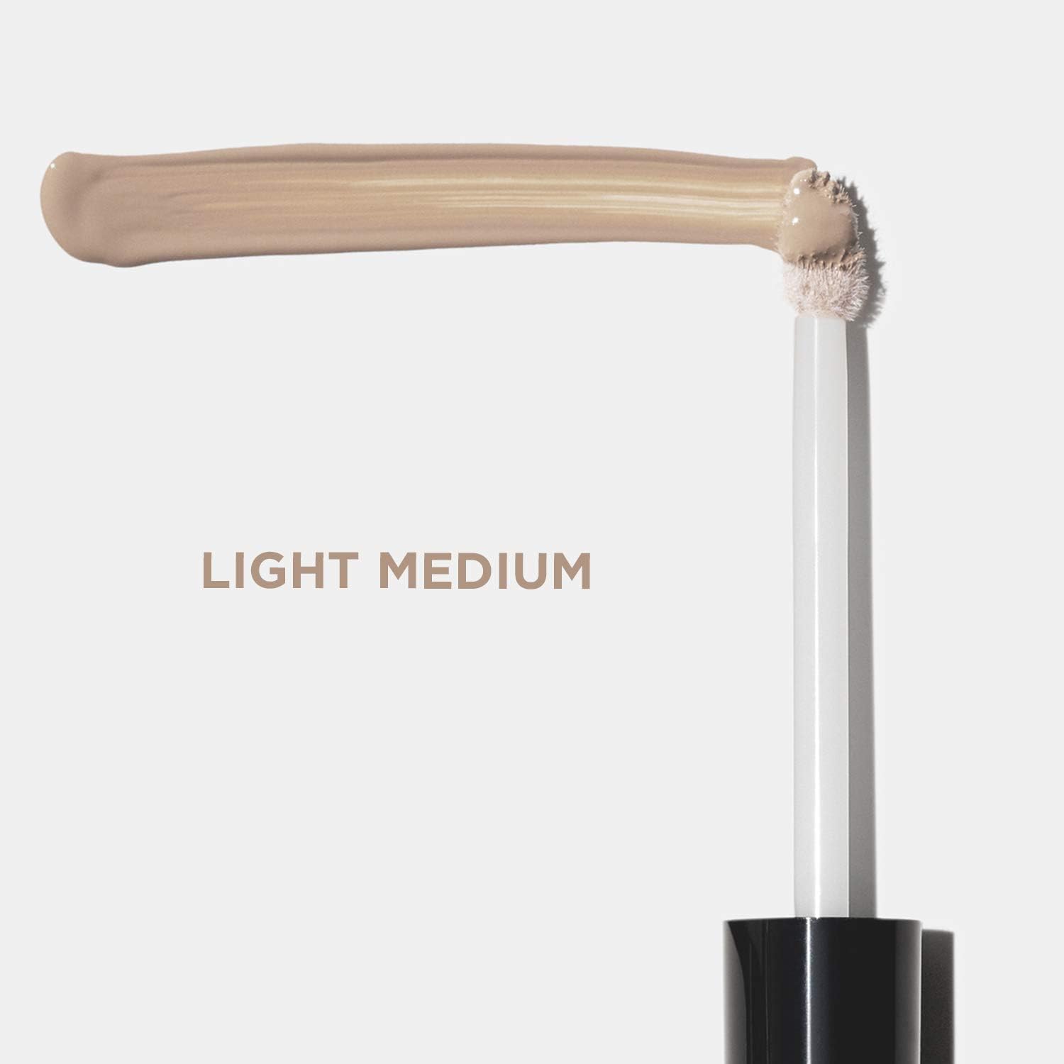 Close-up of Revlon ColorStay concealer texture showing smooth blendability benefit