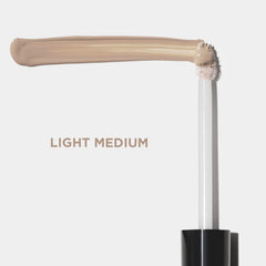 Close-up of Revlon ColorStay concealer texture showing smooth blendability benefit