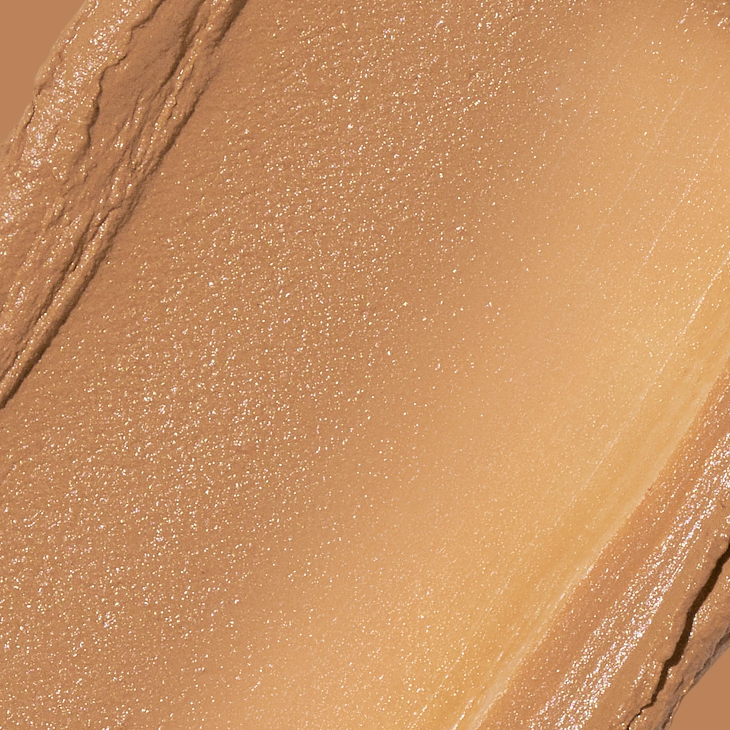 Revlon Glimmer stick creamy texture close-up illustrating smooth blendability