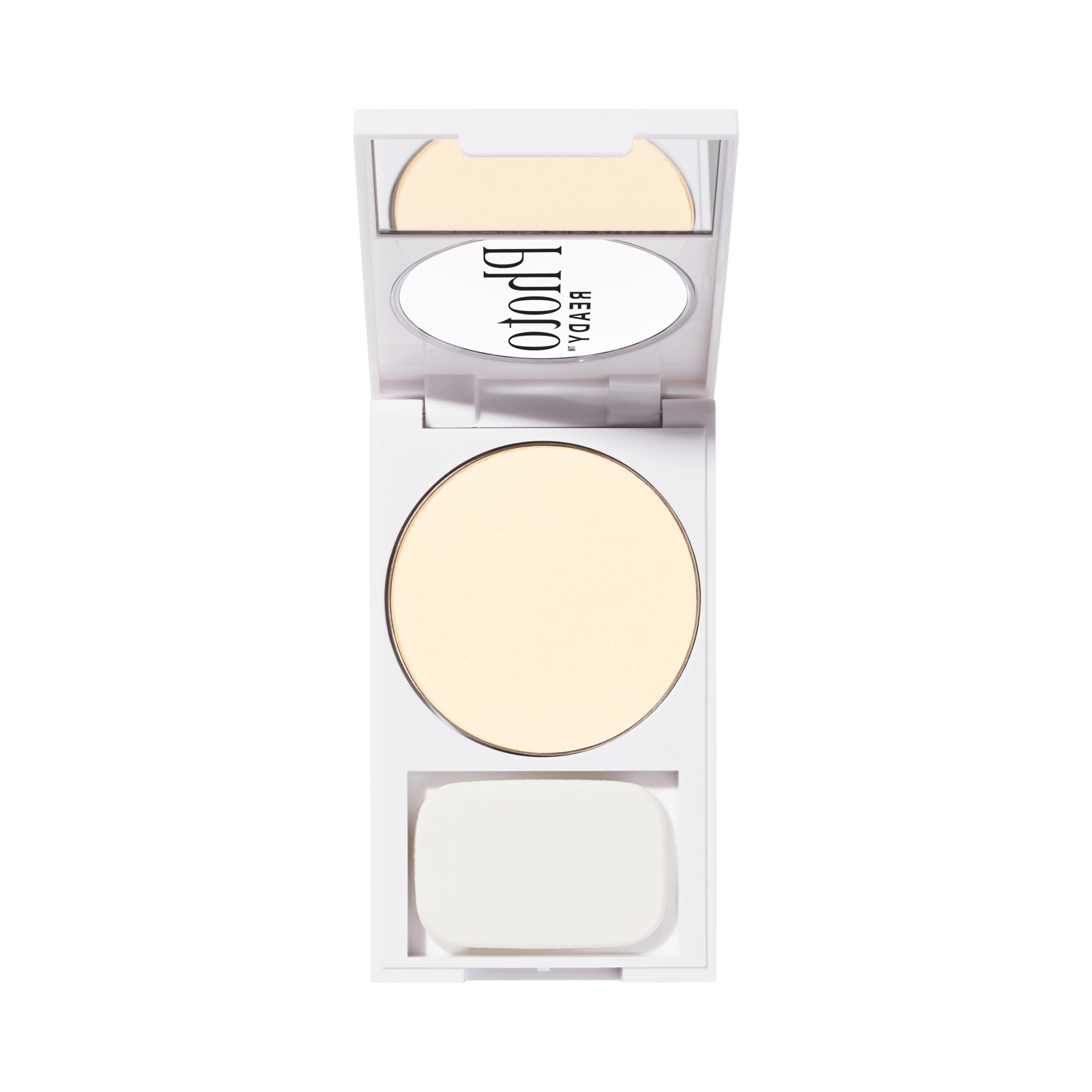 Revlon compact beside hand showing size with brush for convenient touchups