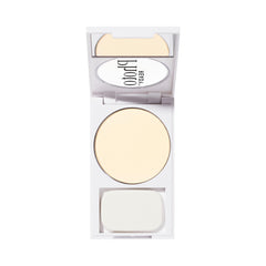 Revlon compact beside hand showing size with brush for convenient touchups