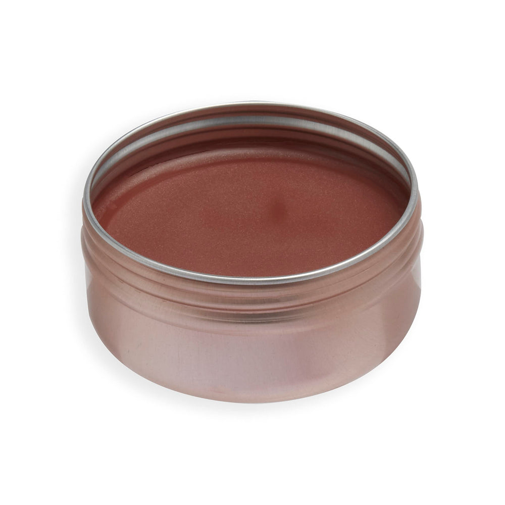 Revolution Balm Glow applied on cheeks and lips demonstrating natural glow