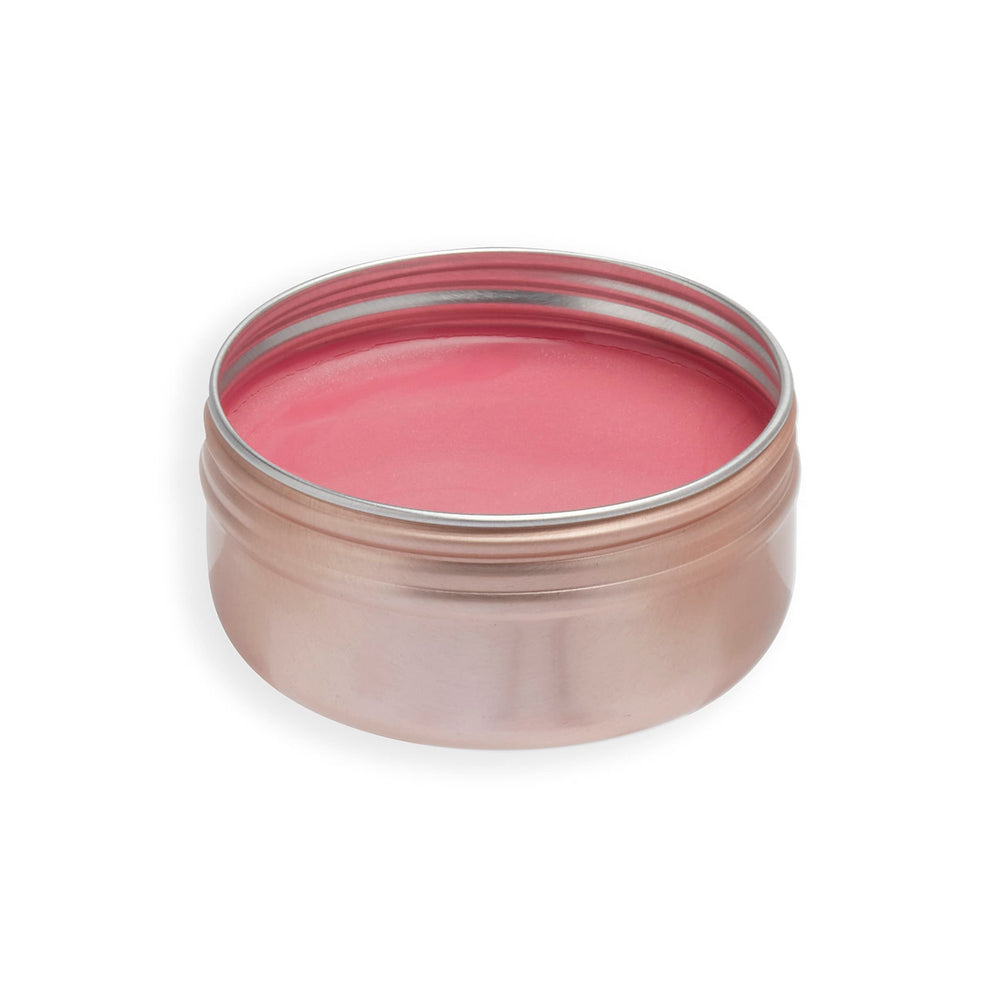 Revolution Balm Glow blended on cheeks demonstrating buildable dewy color