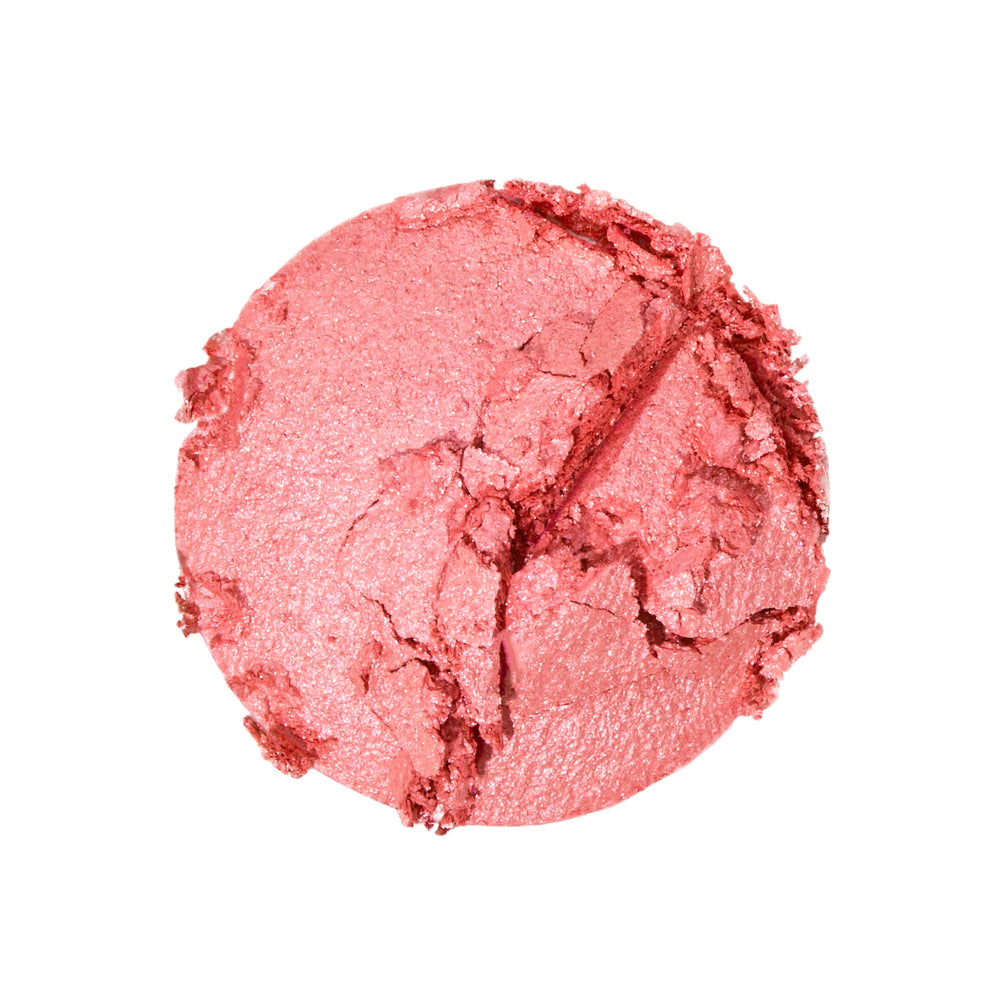 Revolution Beauty London model applying cheeks showing natural luminous benefit