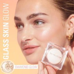 Revolution Beauty applied on cheek highlighting high points with cool reflective sheen