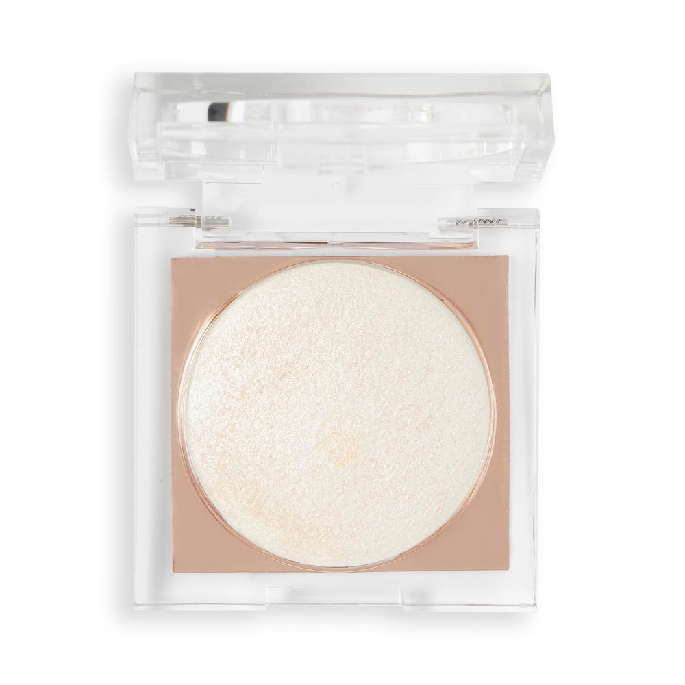 Revolution Beauty compact beside coin to show compact size and portability benefit