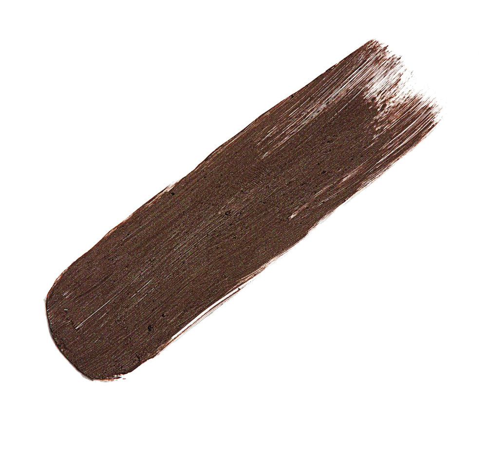 Revolution Brow Pomade angled brush applying cream for precise defined brows