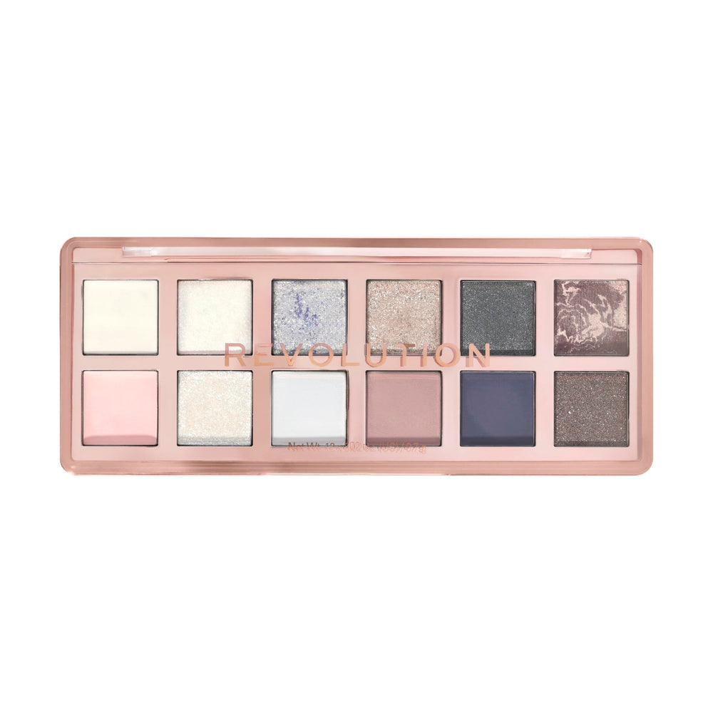 Revolution Skincare London palette held in hand to show scale and travel-friendly compact benefit