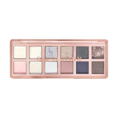 Revolution Skincare London palette held in hand to show scale and travel-friendly compact benefit