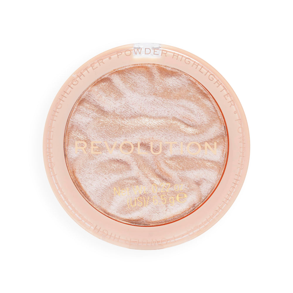 Revolution Beauty London highlighter on vanity with brushes for everyday glow