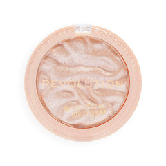 Revolution Beauty London highlighter on vanity with brushes for everyday glow