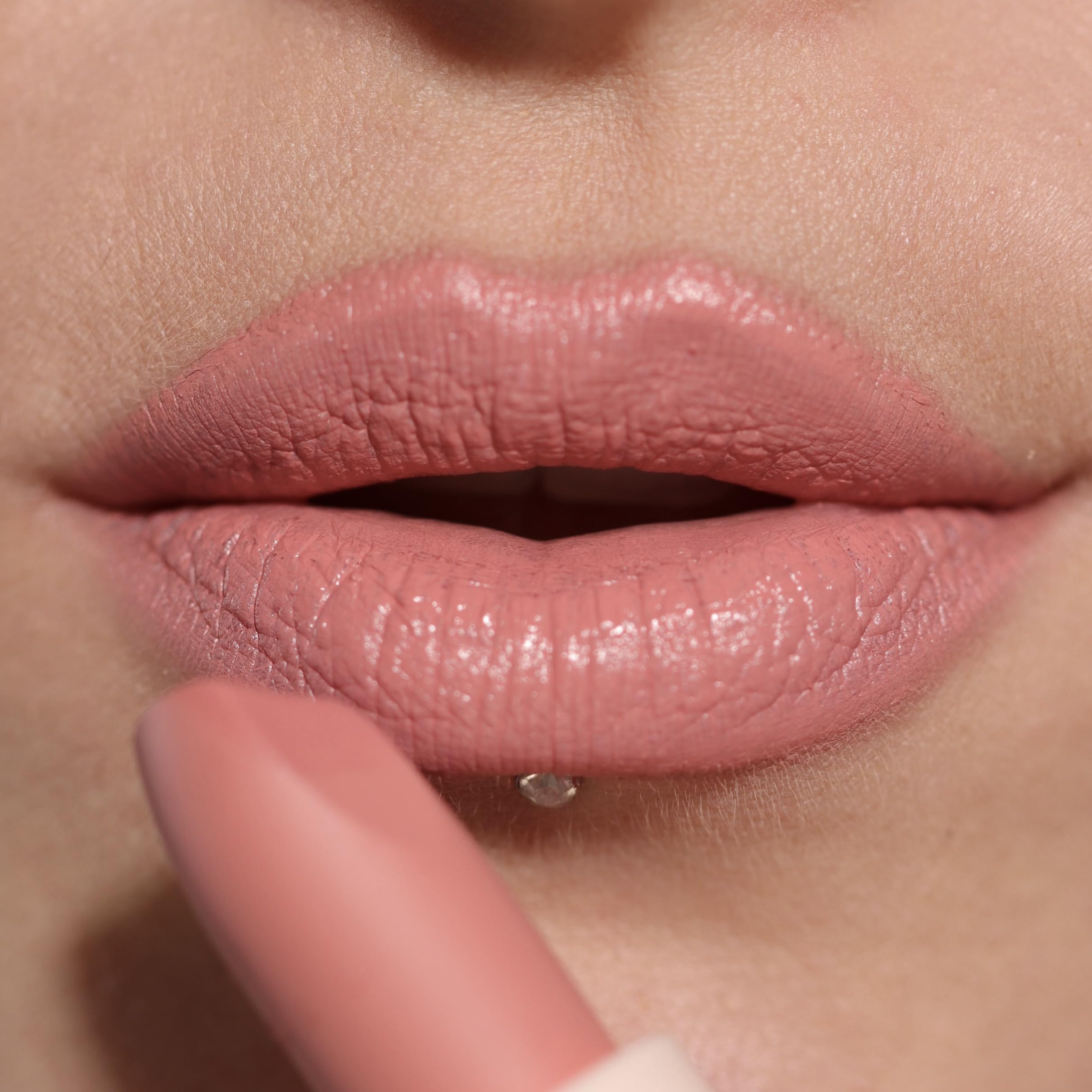 Revolution Lip Allure open tube with cap detail showing compact travel-friendly design