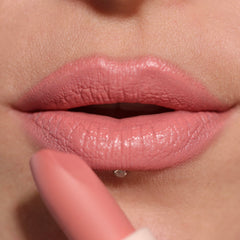 Revolution Lip Allure open tube with cap detail showing compact travel-friendly design