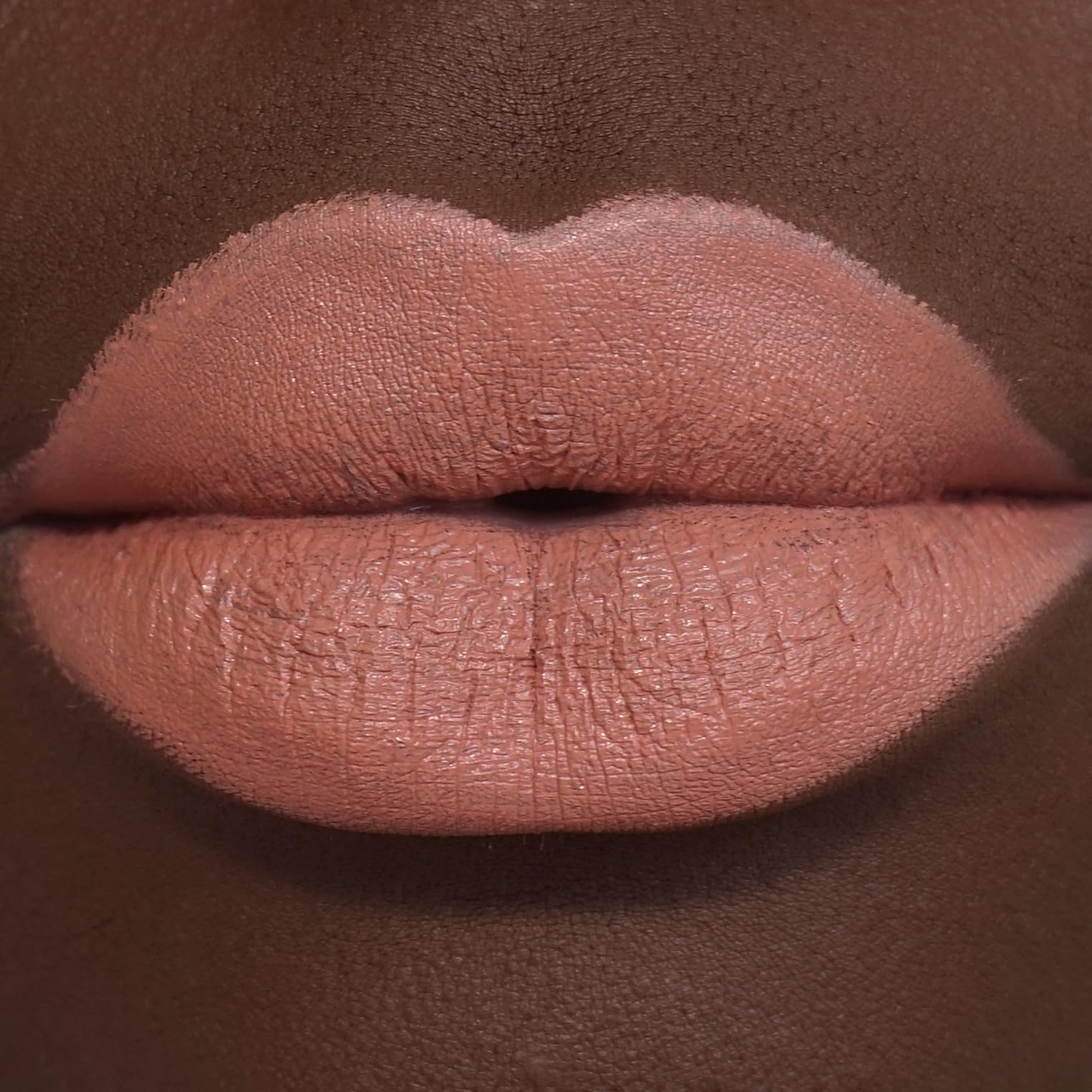 Revolution Beauty London swatch on arm displaying rich Wifey shade and true-to-pigment payoff
