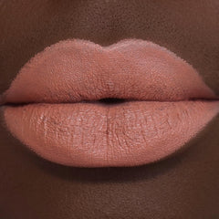 Revolution Beauty London swatch on arm displaying rich Wifey shade and true-to-pigment payoff