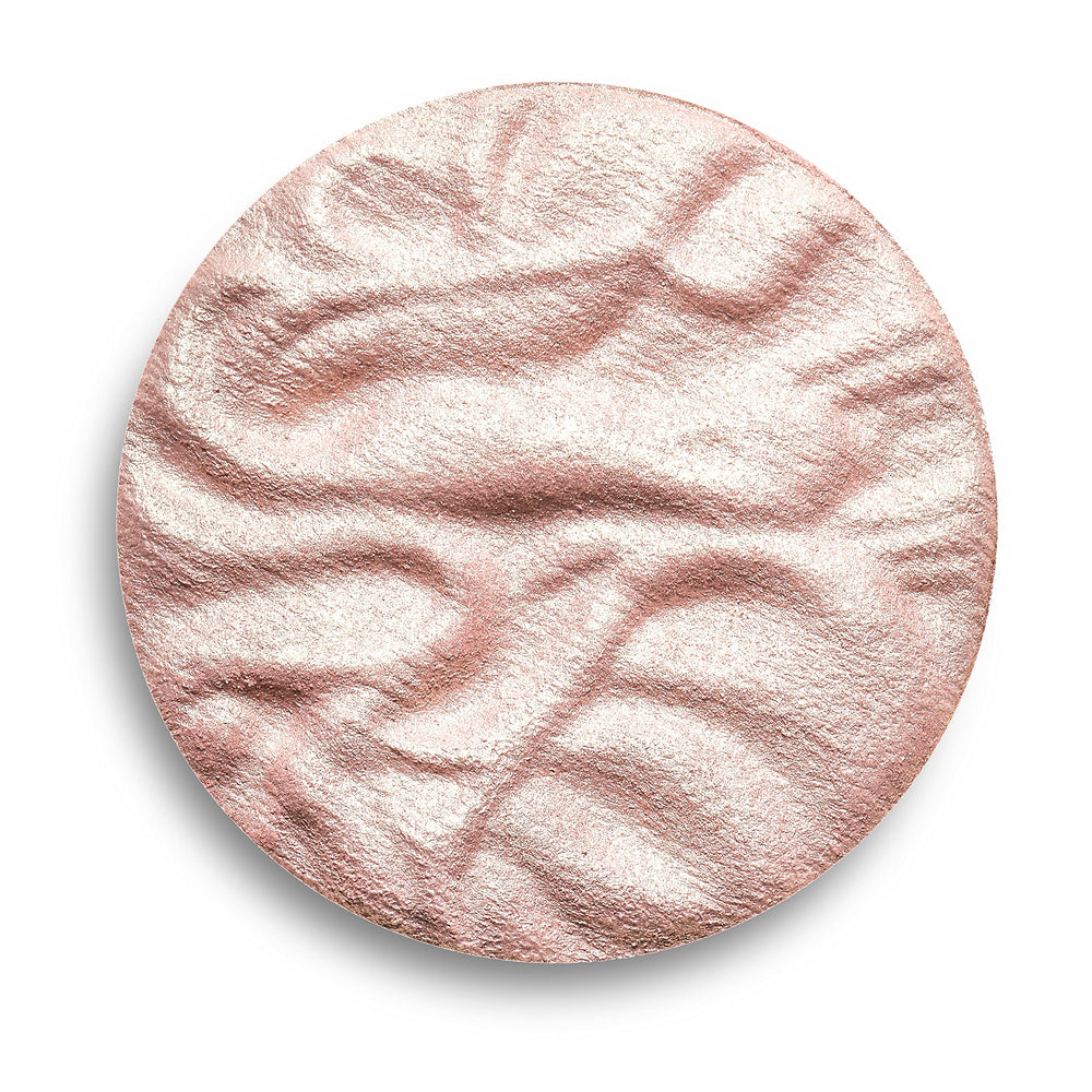 Revolution Beauty London highlighter styled in makeup bag for everyday carry and quick touch-ups