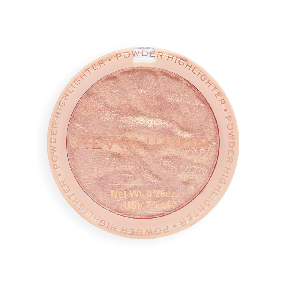 Revolution Beauty London compact beside a coin showing compact size and travel convenience