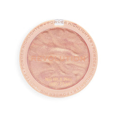 Revolution Beauty London compact beside a coin showing compact size and travel convenience