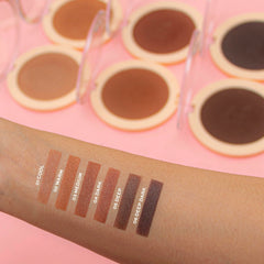 Revolution Mega Bronzer brush application on cheek demonstrating buildable sculpting benefit