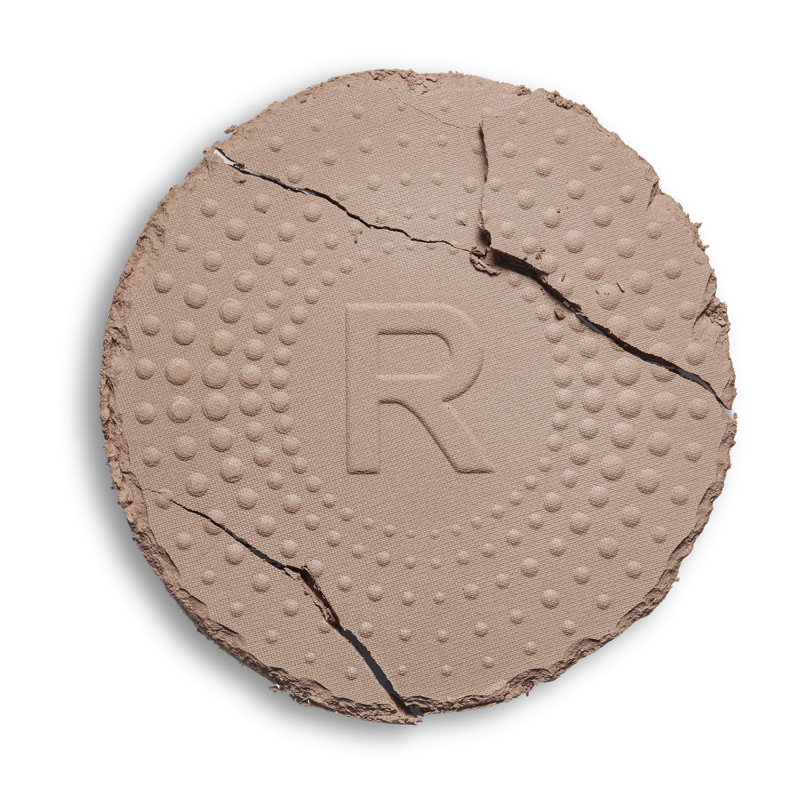 Revolution Mega Bronzer powder close-up texture showing smooth matte finish that blends evenly
