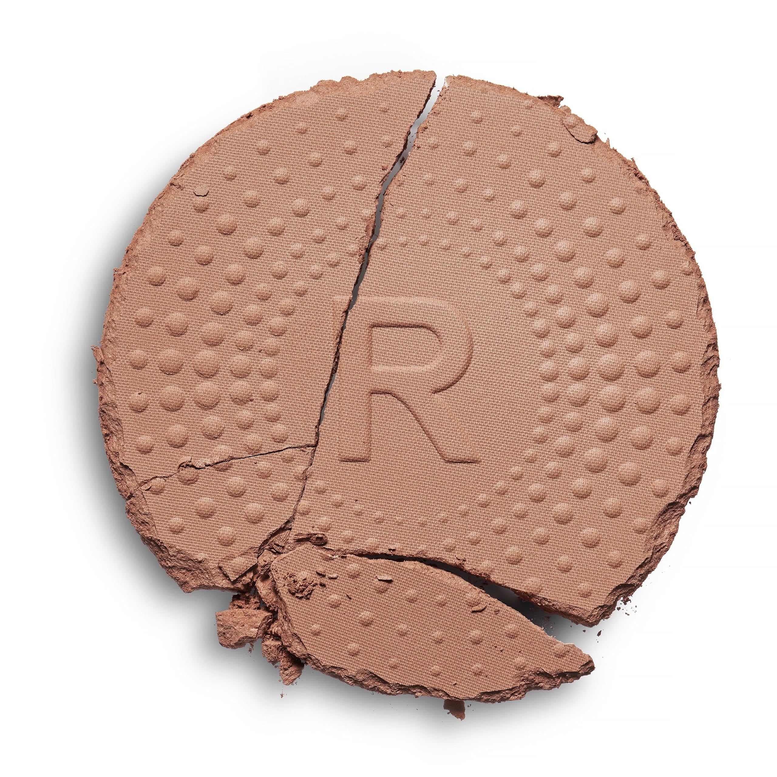 Revolution powder texture close-up demonstrating blendable matte finish benefit