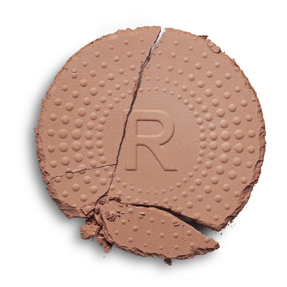 Revolution powder texture close-up demonstrating blendable matte finish benefit