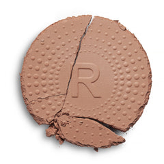 Revolution powder texture close-up demonstrating blendable matte finish benefit