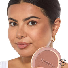 Revolution bronzer held in hand showing compact size and travel-friendly benefit