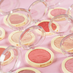 Revolution Beauty London compact next to coin showing compact travel size