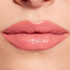 Revolution Beauty London creamy texture swatch on arm, glossy hydration visible