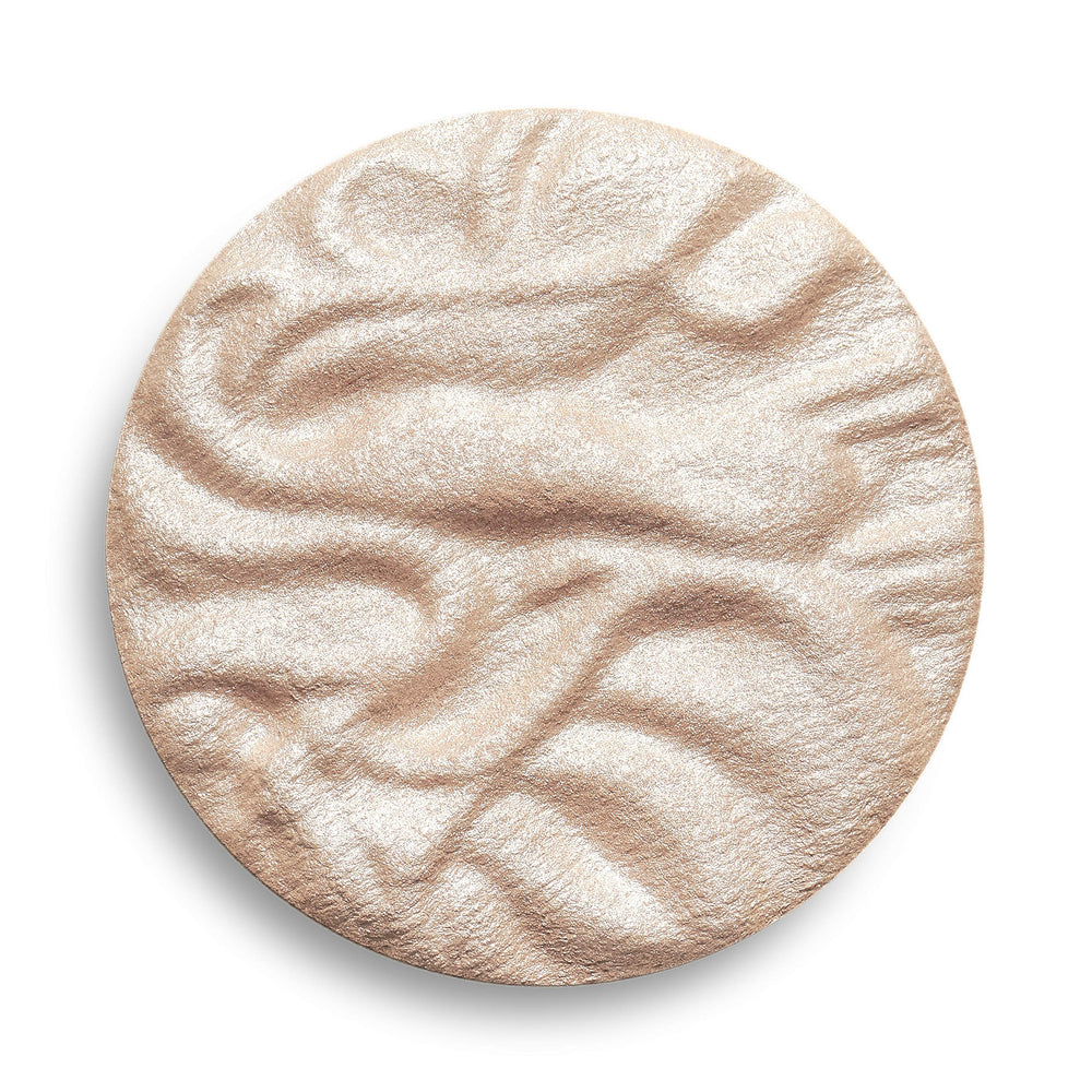 Revolution Beauty London highlighter styled in makeup bag showing everyday glam benefit