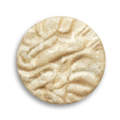 Revolution Beauty London highlighter in a makeup bag for on-the-go radiance