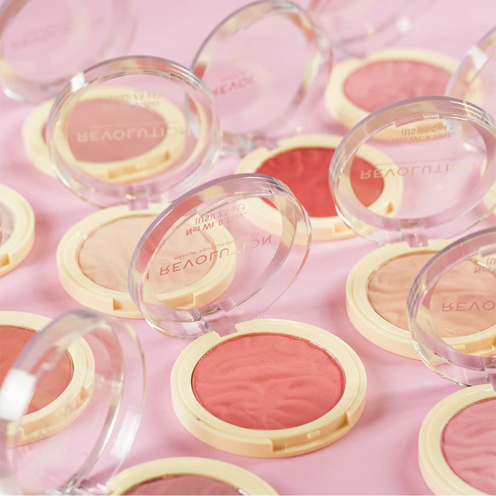Revolution on model medium-deep skin showing flattering cool-pink effect