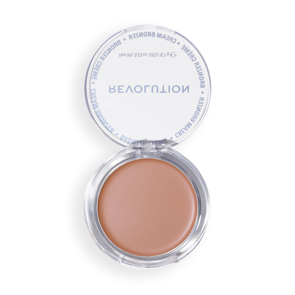 Revolution Beauty London bronzer on vanity with brushes illustrating daily beauty routine
