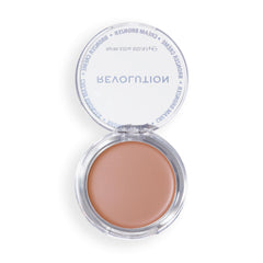 Revolution Beauty London bronzer on vanity with brushes illustrating daily beauty routine