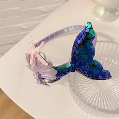 RFTWXHPN green starfish detail on headband adding whimsical focal point