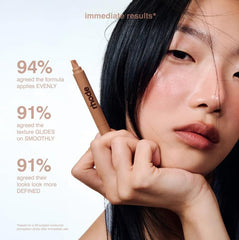 Rhode model applying product demonstrating natural contour and subtle lift benefit
