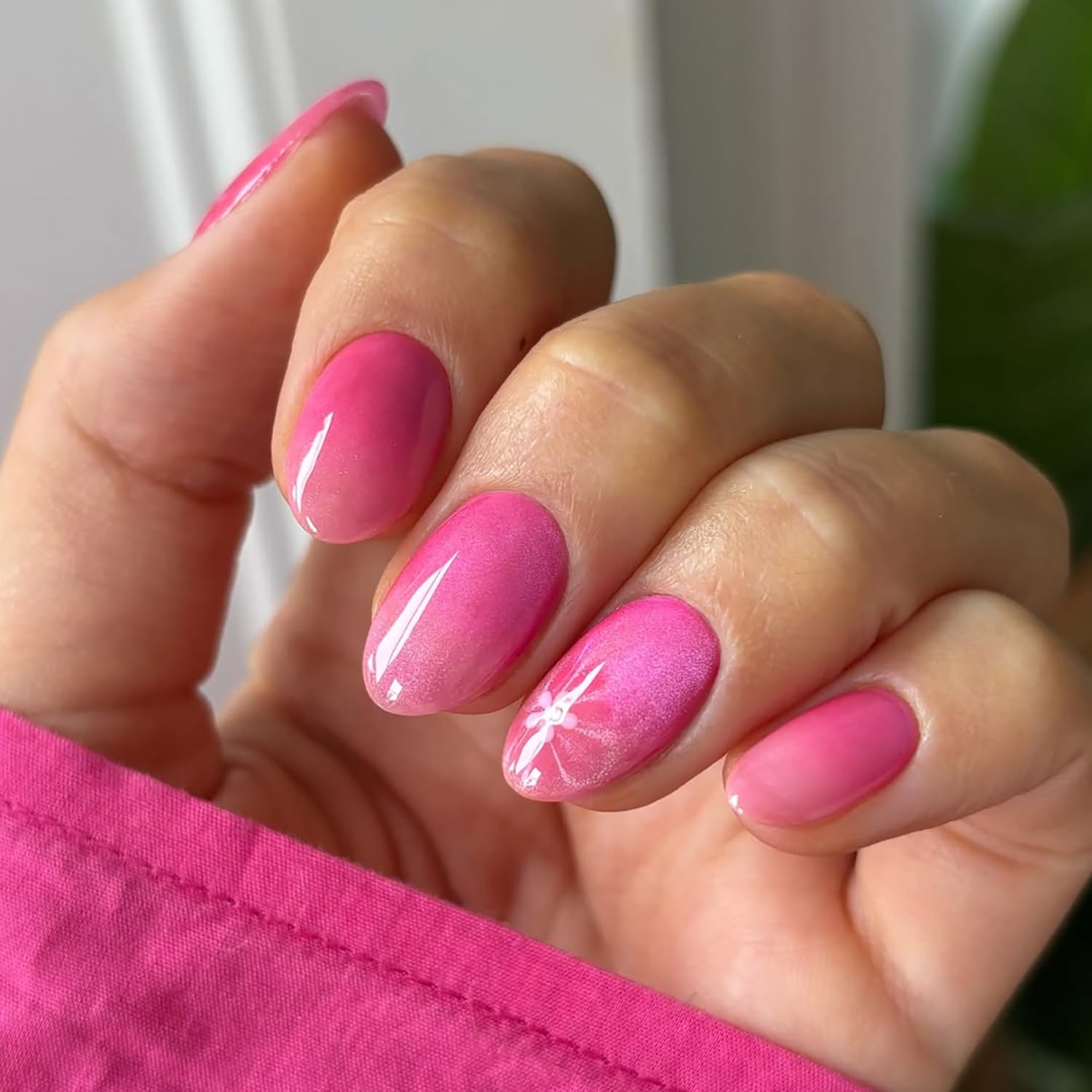 Rhspayh nails applied on a hand in lifestyle scene, demonstrating finished salon-style look