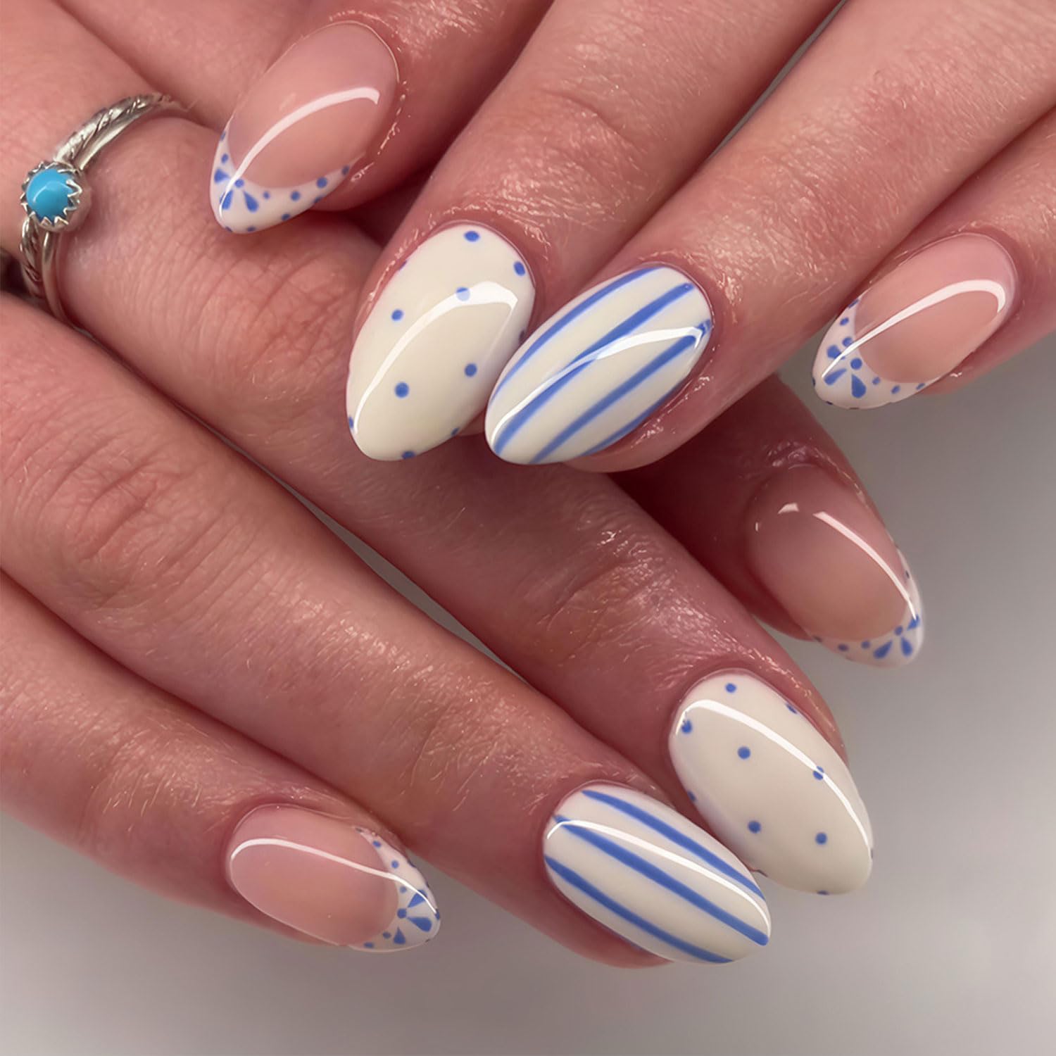 RIICFDD front view of packaged almond press-on nails showing colors and finish benefit