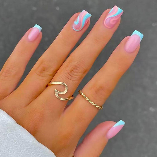 RikView front pack of blue swirl press-on nails showing complete set and benefits