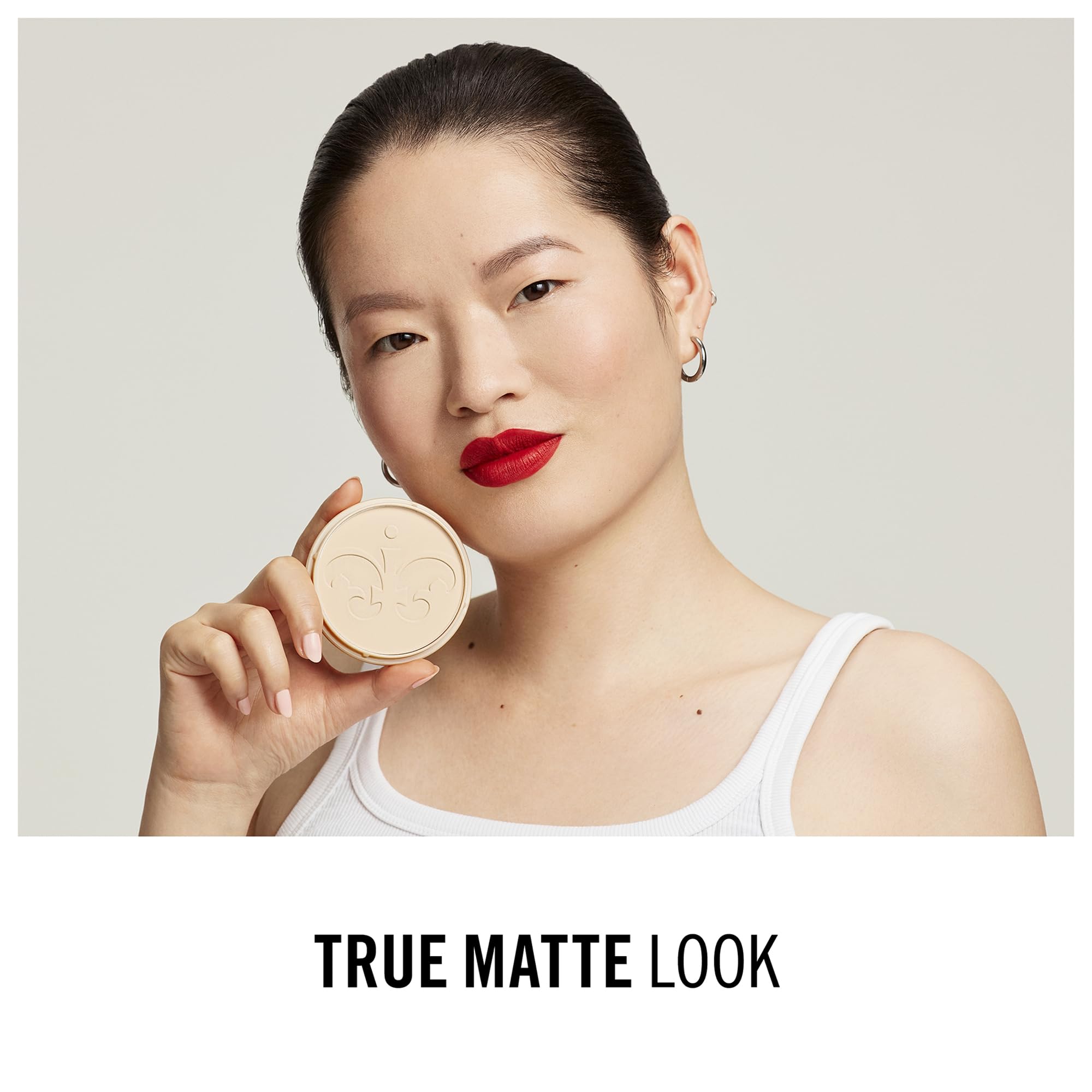 Rimmel Stay Matte being applied with brush to control shine and set makeup