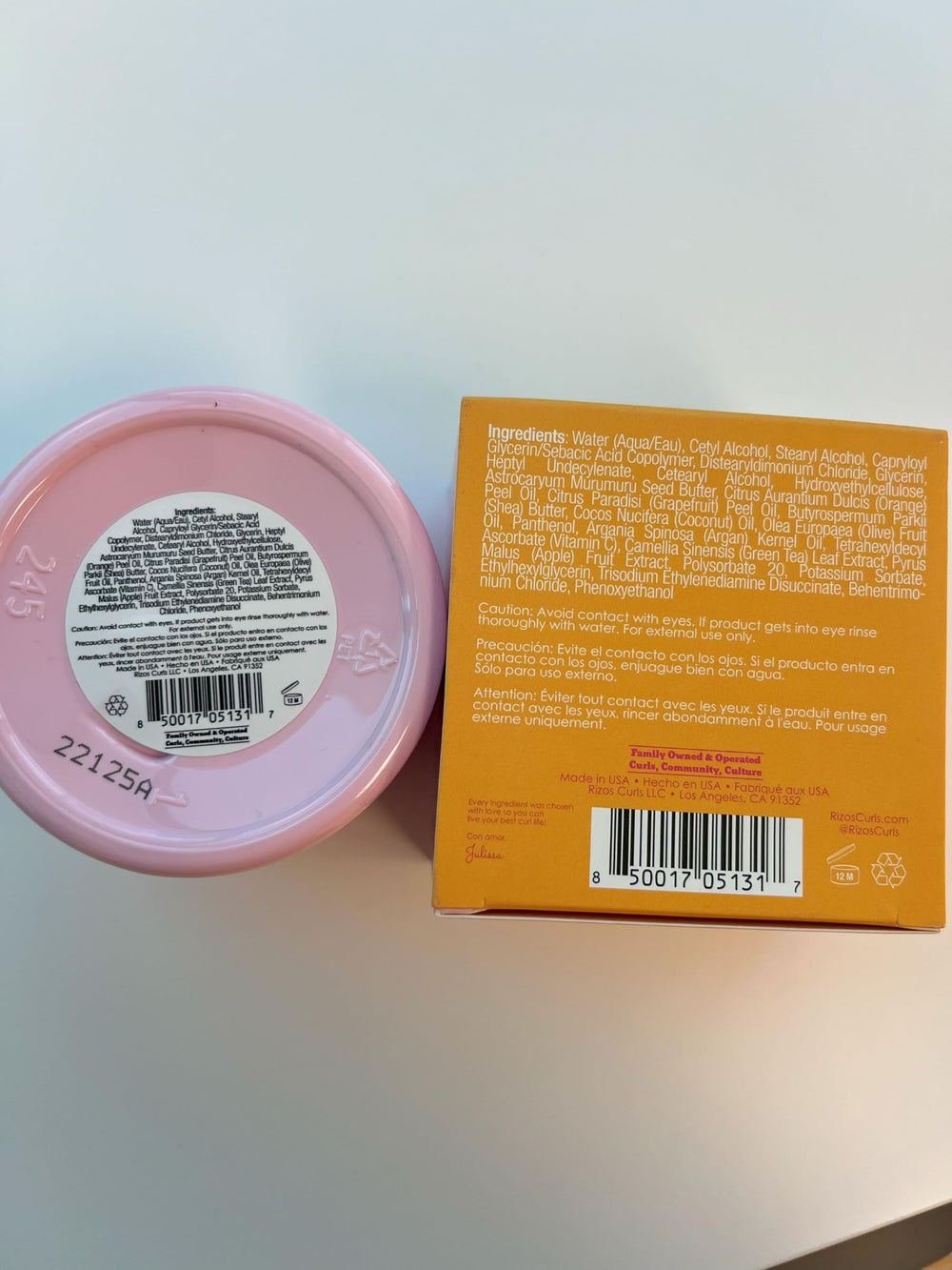 Rizos Curls beside hand for scale showing true 10 oz size benefit