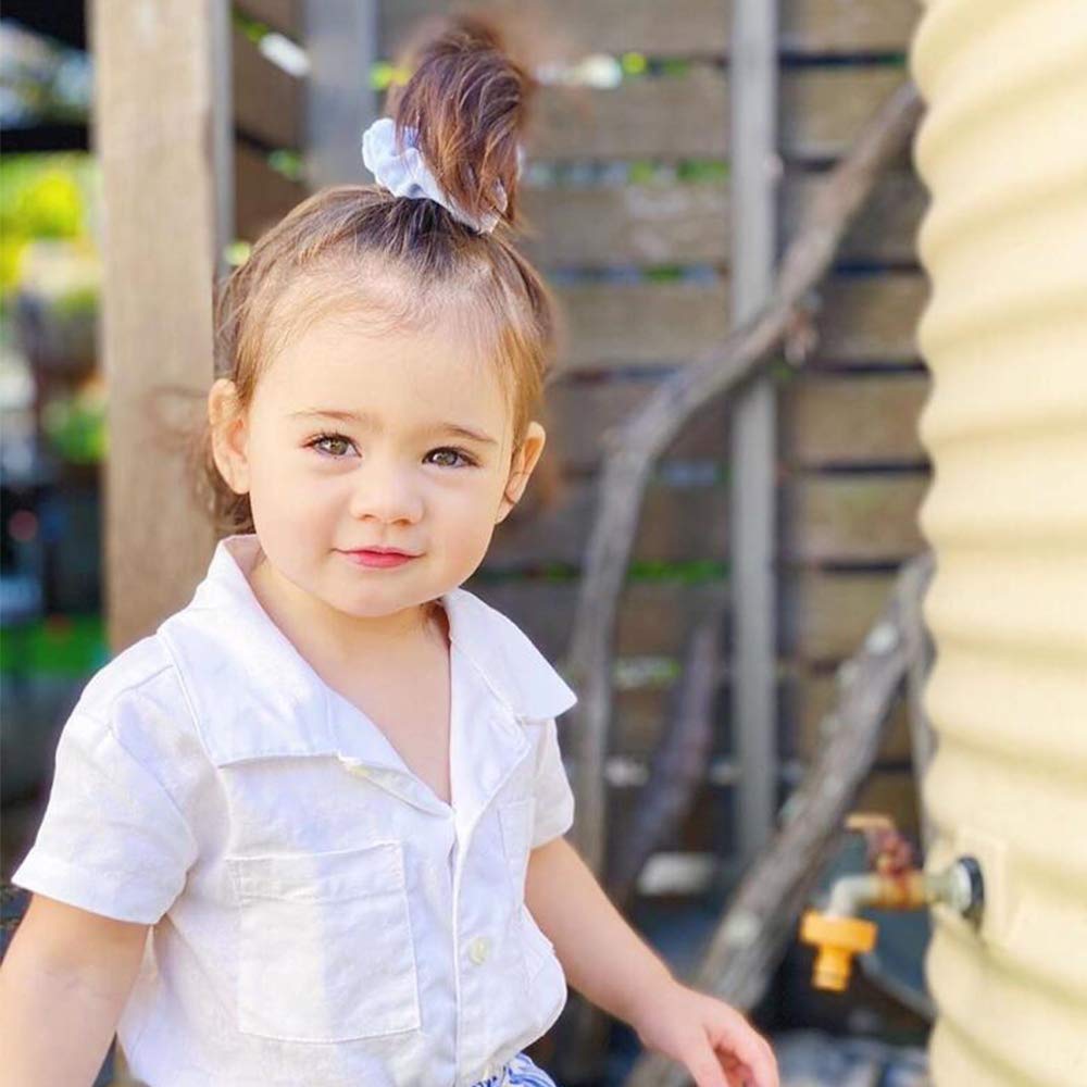 RJMBMUP scrunchie holding a tidy bun showing secure non-slip hold
