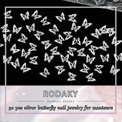 RODAKY charm beside coin for size comparison indicating small scale